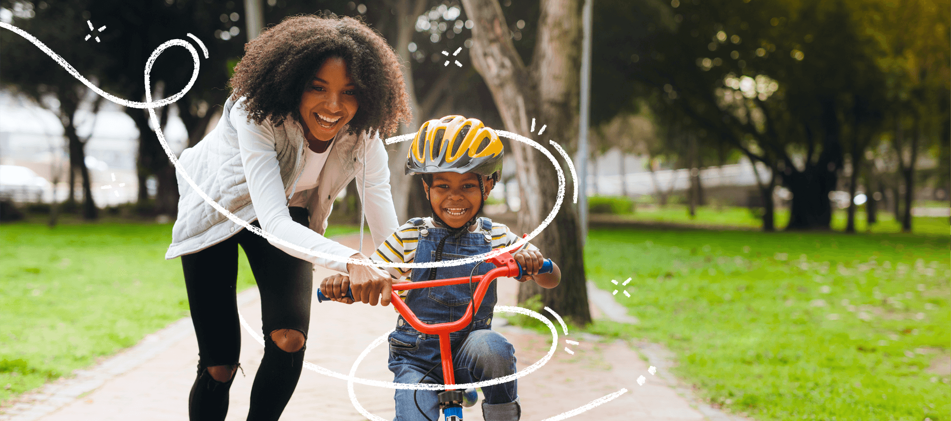 Mother teaching son to ride a bike